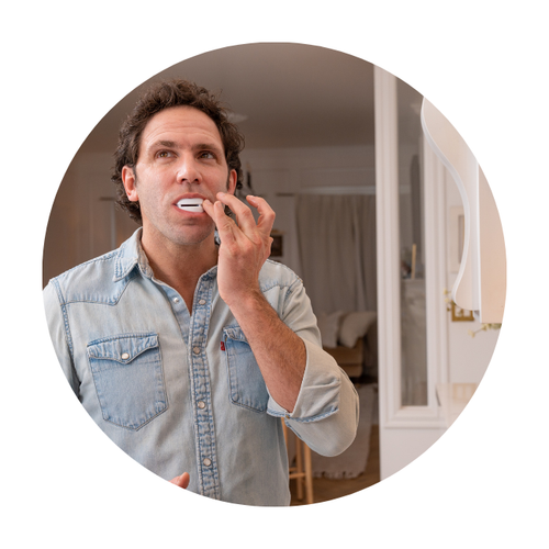 man molding vitalsleep mouthpiece for snoring in kitchen
