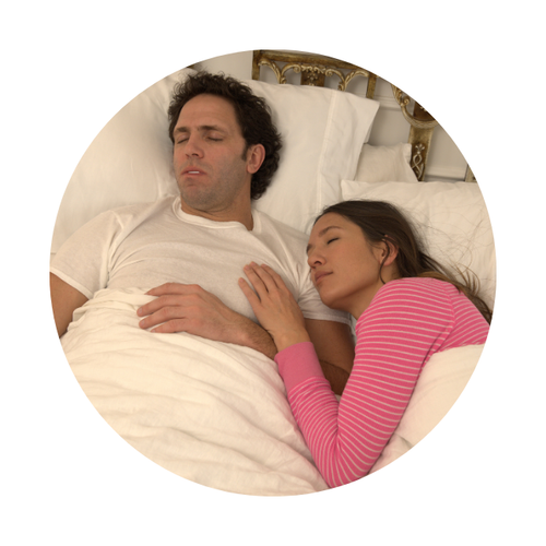 couple sleeping in bed quielty