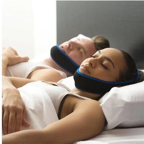 couple sleeping with anti snoring chin straps